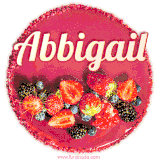 Beautifully decorated red velvet berry birthday cake with vibrant fruits and a glowing 'Abbigail' name, adding a touch of sweetness and sparkle.