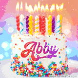A cheerful white birthday cake with multicolor sprinkles, lit candles, and 'Abby' written in vibrant letters, in an animated GIF.