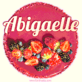 Beautifully decorated red velvet berry birthday cake with vibrant fruits and a glowing 'Abigaelle' name, adding a touch of sweetness and sparkle.