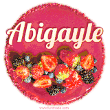 Beautifully decorated red velvet berry birthday cake with vibrant fruits and a glowing 'Abigayle' name, adding a touch of sweetness and sparkle.