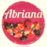 Beautifully decorated red velvet berry birthday cake with vibrant fruits and a glowing 'Abriana' name, adding a touch of sweetness and sparkle.