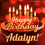Beautifully decorated red velvet berry birthday cake with vibrant fruits and a glowing 'Adalyn' name, adding a touch of sweetness and sparkle.