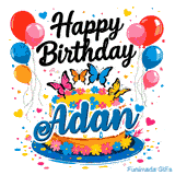 A gold and white glazed birthday cake with blue lettering spelling Adan, surrounded by colorful party decorations.