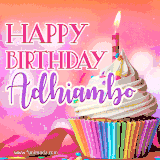 A vibrant birthday GIF featuring a rainbow-colored cupcake topped with white frosting, sprinkles, and a lit candle. The text reads 'Happy Birthday Adhiambo' in bold pink and violet letters with white outline.