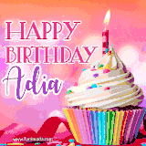 A vibrant birthday GIF featuring a rainbow-colored cupcake topped with white frosting, sprinkles, and a lit candle. The text reads 'Happy Birthday Adia' in bold pink and violet letters with white outline.