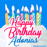 A cheerful animated GIF featuring colorful lit birthday candles on a white cake, with the text 'Happy Birthday Adonias' in bold red and blue script on a bright blue background.