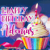 A festive animated GIF featuring a colorful cupcake with a single lit candle, sprinkles, and 'Happy Birthday Adonias' text against a sparkling, celebratory background.