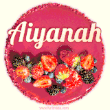 Beautifully decorated red velvet berry birthday cake with vibrant fruits and a glowing 'Aiyanah' name, adding a touch of sweetness and sparkle.