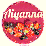 Beautifully decorated red velvet berry birthday cake with vibrant fruits and a glowing 'Aiyanna' name, adding a touch of sweetness and sparkle.