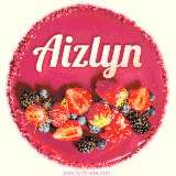 Beautifully decorated red velvet berry birthday cake with vibrant fruits and a glowing 'Aizlyn' name, adding a touch of sweetness and sparkle.