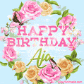 A charming animated GIF featuring 'Happy Birthday Aja' in pink and green text, surrounded by delicate roses, leaves, and fluttering butterflies on a soft light blue pastel background.