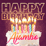 A colorful birthday cake topped with lit candles, with the words 'Happy Birthday Ajambo' in bold glowing letters on a burgundy background. Animated flames add a festive touch.