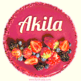 Beautifully decorated red velvet berry birthday cake with vibrant fruits and a glowing 'Akila' name, adding a touch of sweetness and sparkle.