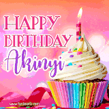 A vibrant birthday GIF featuring a rainbow-colored cupcake topped with white frosting, sprinkles, and a lit candle. The text reads 'Happy Birthday Akinyi' in bold pink and violet letters with white outline.