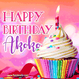 A vibrant birthday GIF featuring a rainbow-colored cupcake topped with white frosting, sprinkles, and a lit candle. The text reads 'Happy Birthday Akoko' in bold pink and violet letters with white outline.