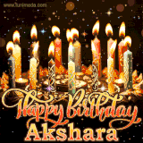 A glowing personalized birthday GIF with name Akshara featuring lit candles with intricate designs, warm lighting, and the text 'Happy Birthday' in an elegant font.