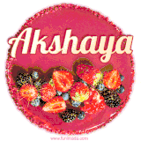 Beautifully decorated red velvet berry birthday cake with vibrant fruits and a glowing 'Akshaya' name, adding a touch of sweetness and sparkle.