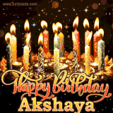 A glowing personalized birthday GIF with name Akshaya featuring lit candles with intricate designs, warm lighting, and the text 'Happy Birthday' in an elegant font.