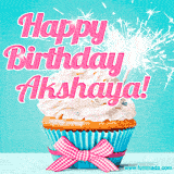 A festive cupcake with pink icing, a gingham bow, and a lit animated sparkler, paired with 'Happy Birthday Akshaya!' in bright pink text.