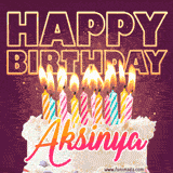 A colorful birthday cake topped with lit candles, with the words 'Happy Birthday Aksinya' in bold glowing letters on a burgundy background. Animated flames add a festive touch.
