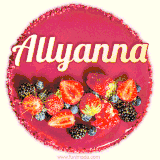 Beautifully decorated red velvet berry birthday cake with vibrant fruits and a glowing 'Allyanna' name, adding a touch of sweetness and sparkle.