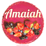 Beautifully decorated red velvet berry birthday cake with vibrant fruits and a glowing 'Amaiah' name, adding a touch of sweetness and sparkle.