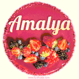 Beautifully decorated red velvet berry birthday cake with vibrant fruits and a glowing 'Amalya' name, adding a touch of sweetness and sparkle.