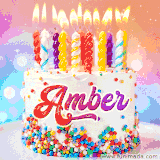 A cheerful white birthday cake with multicolor sprinkles, lit candles, and 'Amber' written in vibrant letters, in an animated GIF.