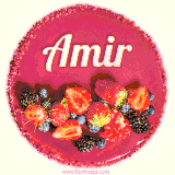 Beautifully decorated red velvet berry birthday cake with vibrant fruits and a glowing 'Amir' name, adding a touch of sweetness and sparkle.