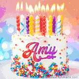A cheerful white birthday cake with multicolor sprinkles, lit candles, and 'Amy' written in vibrant letters, in an animated GIF.