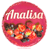 Beautifully decorated red velvet berry birthday cake with vibrant fruits and a glowing 'Analisa' name, adding a touch of sweetness and sparkle.