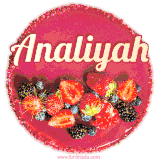 Beautifully decorated red velvet berry birthday cake with vibrant fruits and a glowing 'Analiyah' name, adding a touch of sweetness and sparkle.