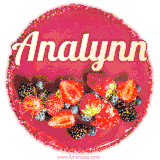 Beautifully decorated red velvet berry birthday cake with vibrant fruits and a glowing 'Analynn' name, adding a touch of sweetness and sparkle.