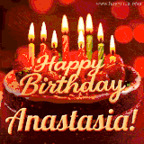 Beautifully decorated red velvet berry birthday cake with vibrant fruits and a glowing 'Anastasia' name, adding a touch of sweetness and sparkle.