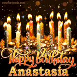 A glowing personalized birthday GIF with name Anastasia featuring lit candles with intricate designs, warm lighting, and the text 'Happy Birthday' in an elegant font.