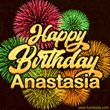 Golden text reading 'Happy Birthday Anastasia' surrounded by vibrant fireworks in red, green, and yellow, set against a dark background in this celebratory birthday GIF.