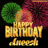 A captivating GIF with bursts of green, pink, and orange fireworks lighting up the night sky, accompanied by 'Happy Birthday Aneesh' in glowing golden text.