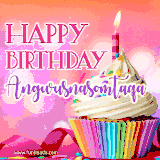 A vibrant birthday GIF featuring a rainbow-colored cupcake topped with white frosting, sprinkles, and a lit candle. The text reads 'Happy Birthday Angwusnasomtaqa' in bold pink and violet letters with white outline.