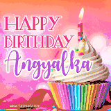 A vibrant birthday GIF featuring a rainbow-colored cupcake topped with white frosting, sprinkles, and a lit candle. The text reads 'Happy Birthday Angyalka' in bold pink and violet letters with white outline.