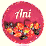 Beautifully decorated red velvet berry birthday cake with vibrant fruits and a glowing 'Ani' name, adding a touch of sweetness and sparkle.