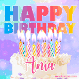 A vibrant animated name GIF with the words 'Happy Birthday Ania' with colorful candles on a creamy cake. The background sparkles with pastel shades, adding a festive touch.