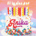 Personalized for Anika elegant birthday cake adorned with rainbow sprinkles, colorful candles and glitter