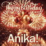 Close-up of metallic red and gold party balloons tied to a decorative present box with Anikas name on a gold stand.