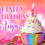 A vibrant birthday GIF featuring a rainbow-colored cupcake topped with white frosting, sprinkles, and a lit candle. The text reads 'Happy Birthday Anja' in bold pink and violet letters with white outline.