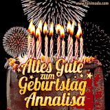A chocolate birthday cake with glowing candles, the German text 'Alles Gute zum Geburtstag Annalisa,' and vibrant fireworks lighting up the background in an animated GIF.
