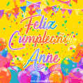 A bright and festive GIF with the text 'Feliz Cumpleaños Anne' in Spanish in colorful fonts, surrounded by confetti, balloons, and festive banners on a vibrant yellow background.