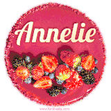 Beautifully decorated red velvet berry birthday cake with vibrant fruits and a glowing 'Annelie' name, adding a touch of sweetness and sparkle.