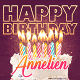 A colorful birthday cake topped with lit candles, with the words 'Happy Birthday Annelien' in bold glowing letters on a burgundy background. Animated flames add a festive touch.