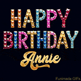 Vibrant luxury birthday greeting card for Annie, showing glittering gemstone letters and golden calligraphy on a dark background with twinkling shine effects.
