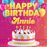 Pink-themed animated greeting with balloons, confetti, and a frosted cake under the message 'Happy Birthday Annie' in bold rounded yellow font.